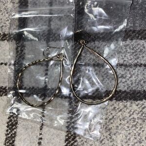 Woman’s silver teardrop dangle earrings